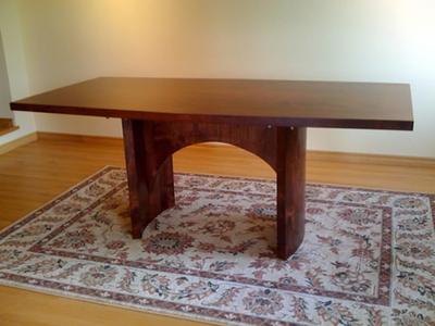 Conference table from the side, showing the arched base