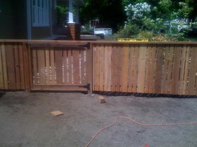 Wood fence with horizontal-top panels