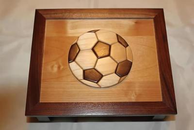 Keepsake box with an inlaid wooden soccer ball on the lid