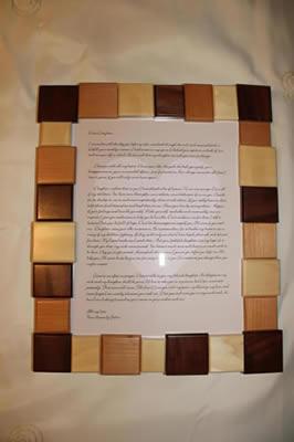 Picture frame made of alternating light and dark wood blocks
