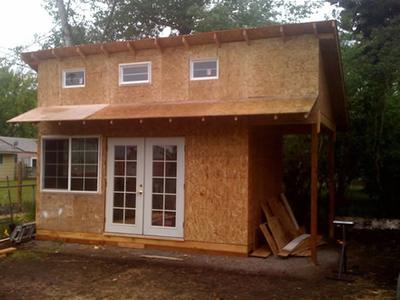 Finished shed with French doors and a loft window