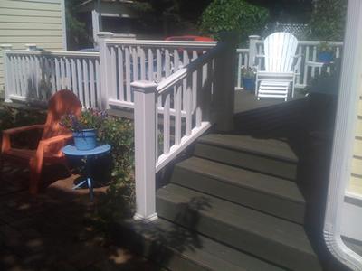 Steps and white railings on the steel deck