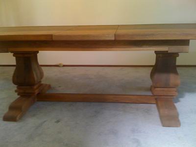 Dining table base and top assembled in the shop